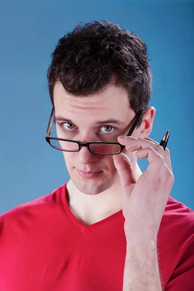 Man with glasses and a pen — Stock Photo, Image