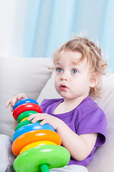 Toddler playing with toys — Stock Photo, Image