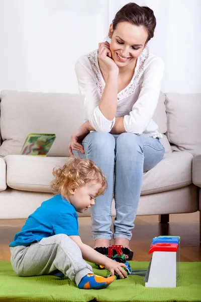 Mother and playing child — Stock Photo, Image