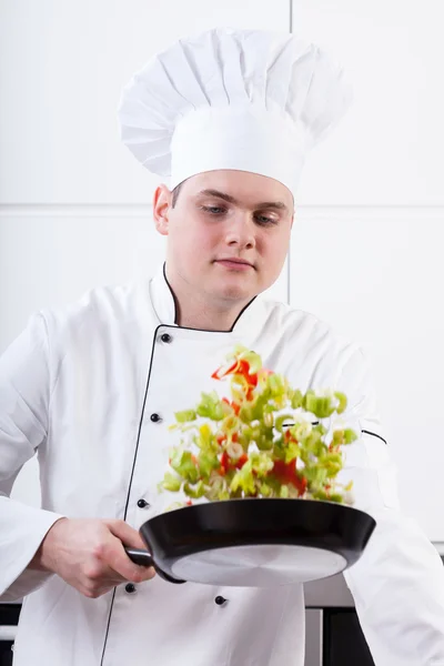 Professional cook frying — Stock Photo, Image