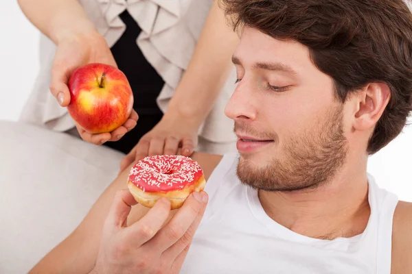 Donut versus apple — Stock Photo, Image