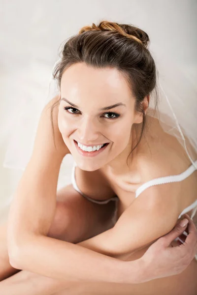 Sensual bride wearing white lingerie and white veil — Stock Photo, Image