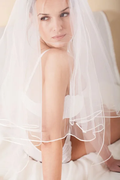 Sensual wife hiding under the white veil — Stock Photo, Image