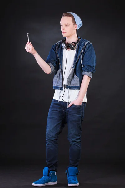 Boy holding marijuana joint — Stock Photo, Image