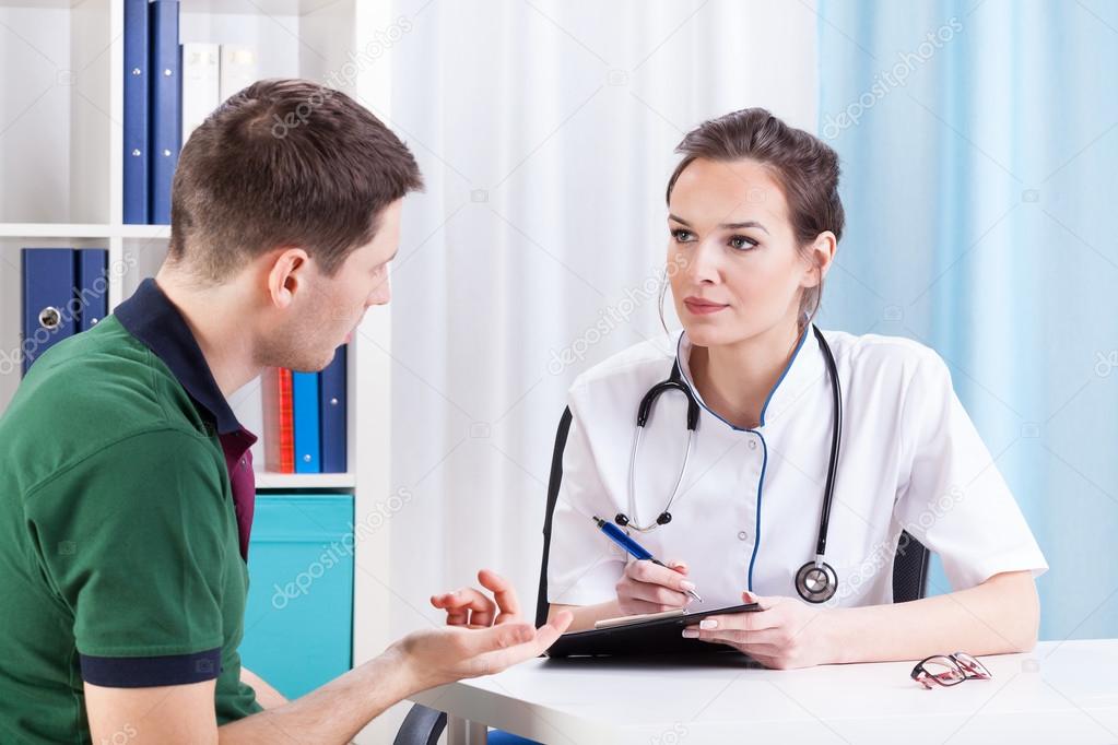 Doctor talking with patient