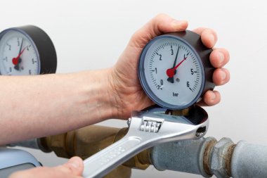 Repair of a pressure gauge clipart