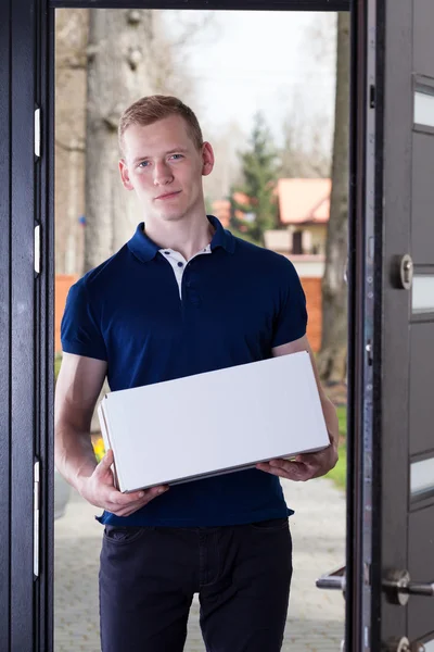 Man with a package — Stock Photo, Image