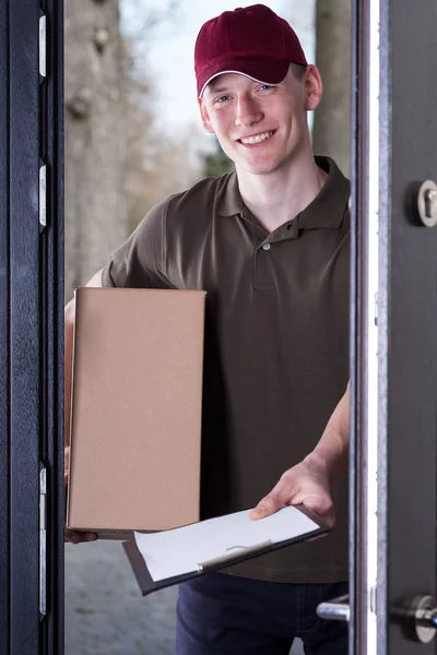 The courier gives the documents for signature — Stock Photo, Image