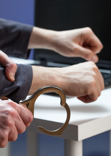 Handcuffing a hacker — Stock Photo, Image