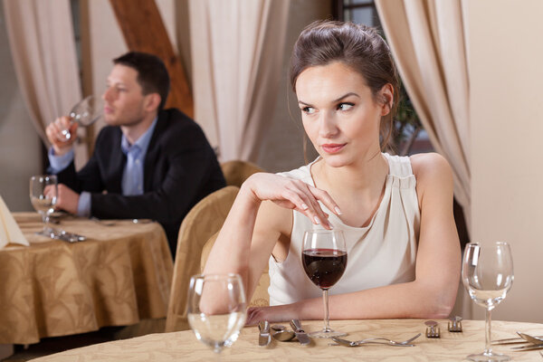 Woman drinking wine in a restaurant