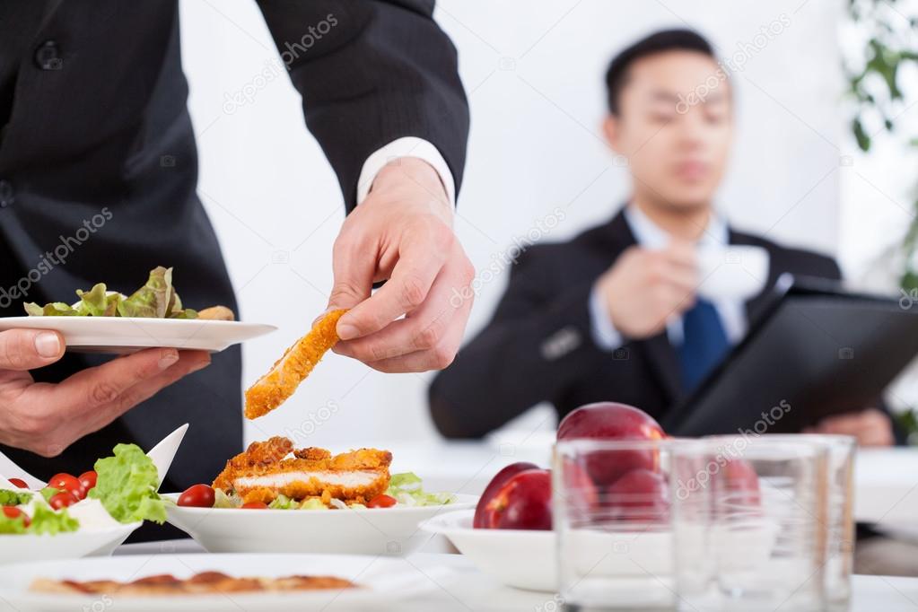 Men during business lunch