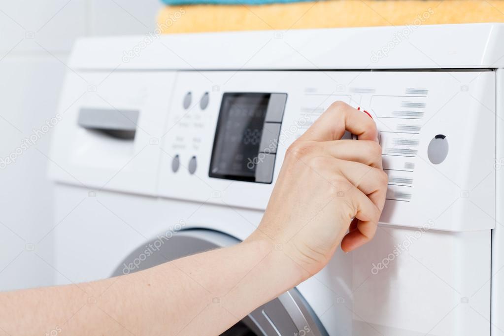 Turning on the washing machine