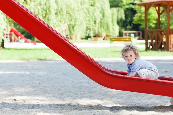 Boy on slide — Stock Photo, Image