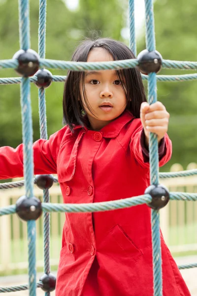 Menina no parque infantil — Fotografia de Stock