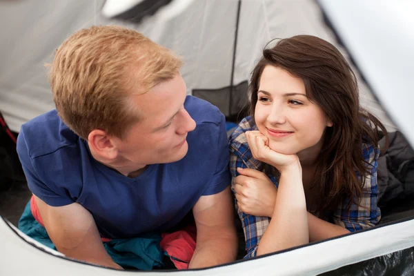 Couple lying in a tent — Stock Photo, Image