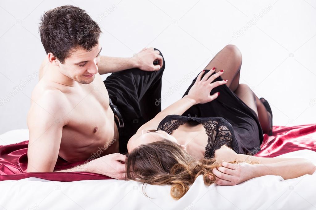 Sexy couple lying in bed