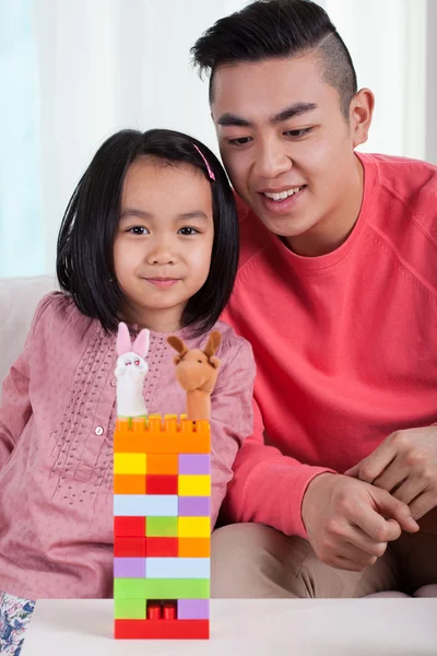 Asian family and their castle — Stock Photo, Image