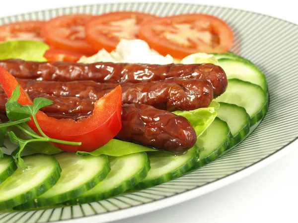 Grilled pork sausages with vegetables — Stock Photo, Image