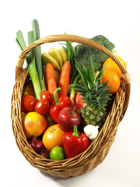Vegetables and fruits in a basket. isolated 