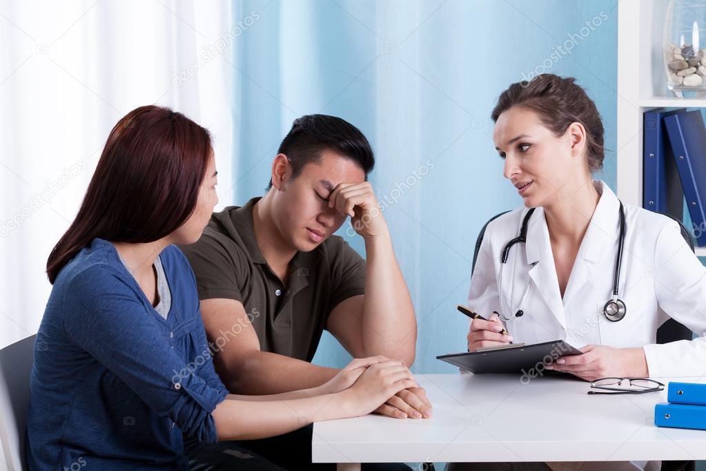 Female doctor talking with her patients
