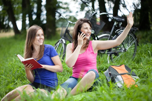 Girls relaxing on a glade — Stock Photo, Image