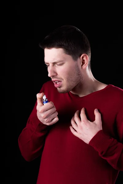 Man taking medicine for sore throat — Stock Photo, Image