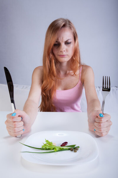 Thin girl and her little breakfast