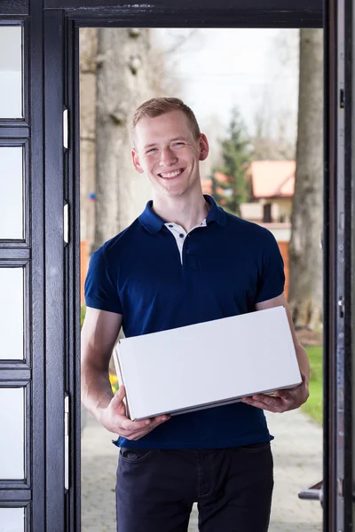 Courier standing with box — Stock Photo, Image