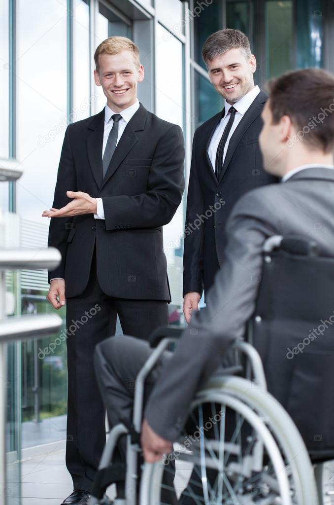 Businessman showing welcome gesture