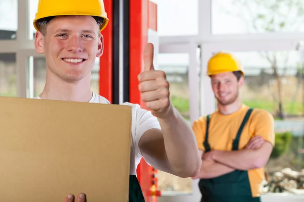 Worker showing thumbs up sign — Stock Photo, Image