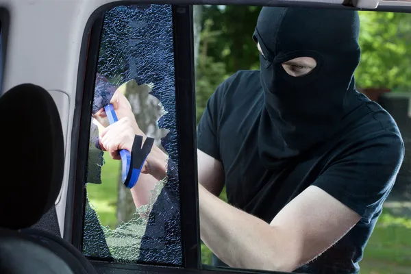 Car thief with crowbar — Stock Photo, Image