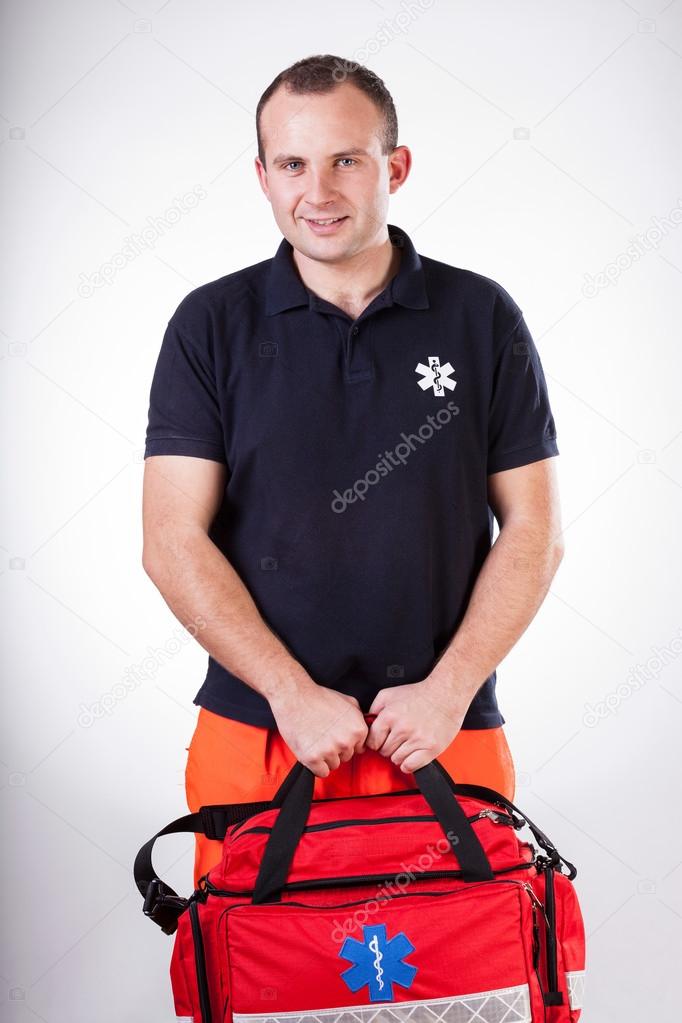 Paramedic with first aid kit