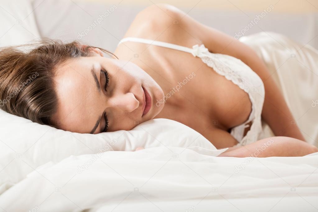 Woman sleeping in sexy underwear Stock Photo by ©photographee.eu 50986489