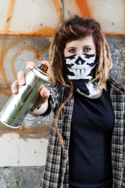 Female hooligan holding graffiti spray — Stock Photo, Image