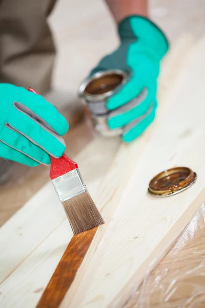 Man's hands painting board — Stock Photo, Image