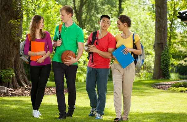 Happy college students outdoors — Stock Photo, Image