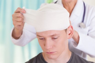 Boy with trauma of the head clipart