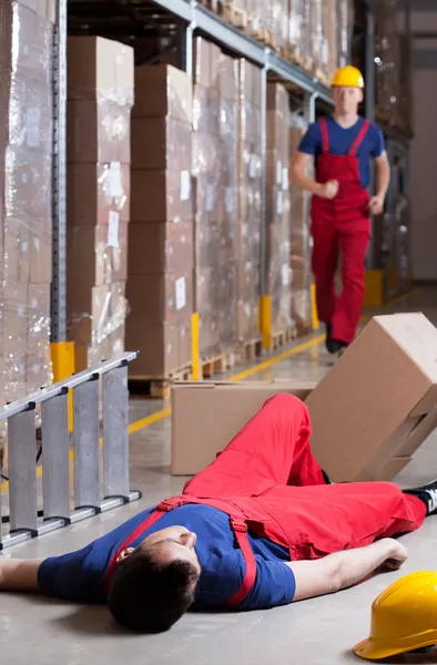 Warehouseman after accident at height — Stock Photo, Image