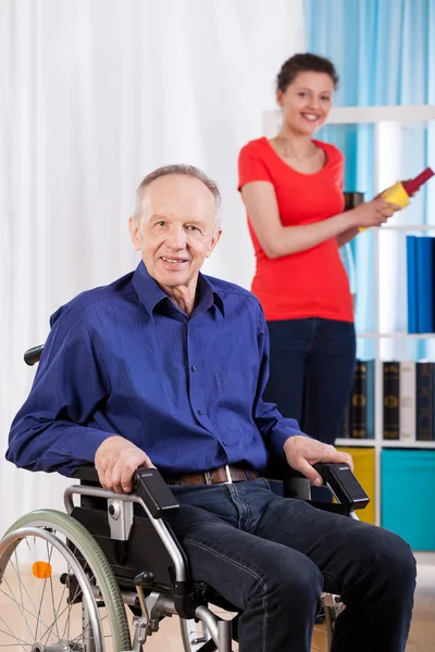 Disabled man and helpful granddaughter — Stock Photo, Image