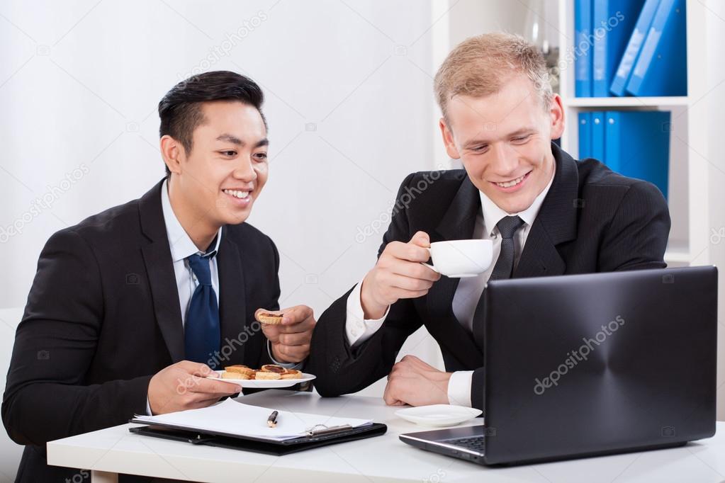 Businessmen eating lunch