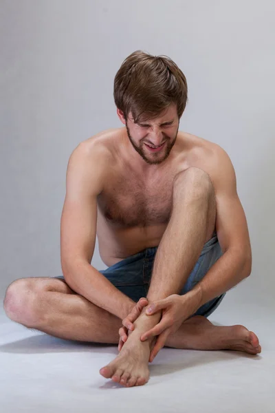 Strong ankle pain — Stock Photo, Image