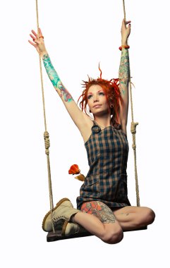 bir salıncak üzerinde kırmızı mürekkep kız