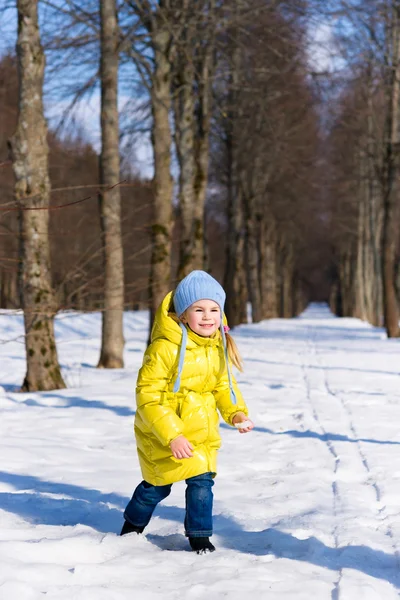 Funny little girl playing in winter — Stock Photo, Image