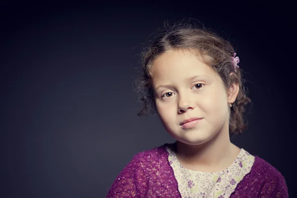 Beautiful face of a girl with curly hair — Stock Photo, Image