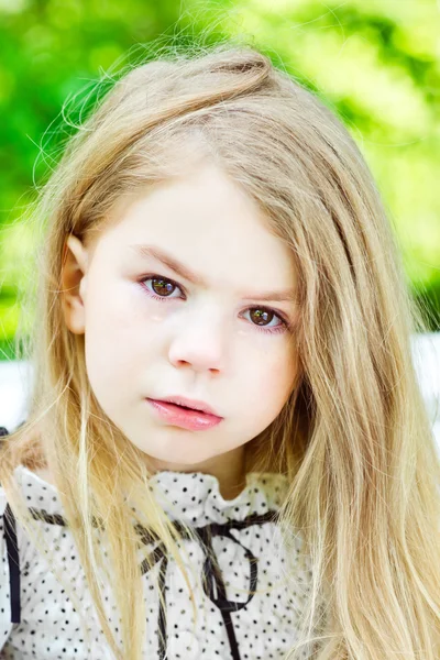 Beautiful blond crying little girl with tears on her cheeks — Stock Photo, Image