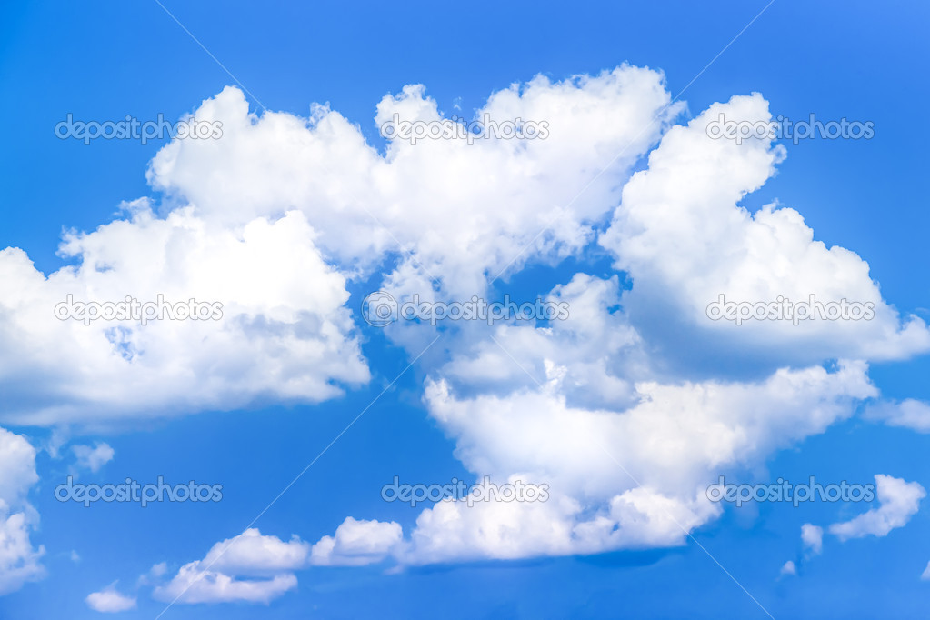 Cumulus clouds (fluffy and relief) in blue sky