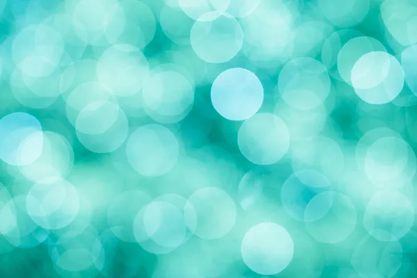 Fundo festivo azul, verde e turquesa com luzes desfocadas bokeh, cores de hortelã vintage Fotos De Bancos De Imagens