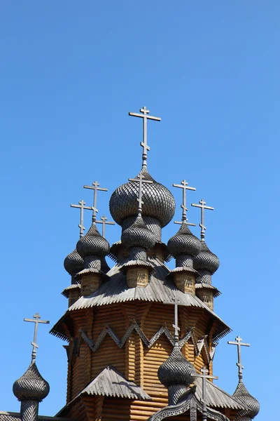 Wooden domes and crosses on sky background — Stock Photo, Image