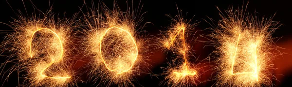 ¡Feliz Año Nuevo 2014! Número de luces de fuegos artificiales Sparkler 2014 . Fotos De Stock