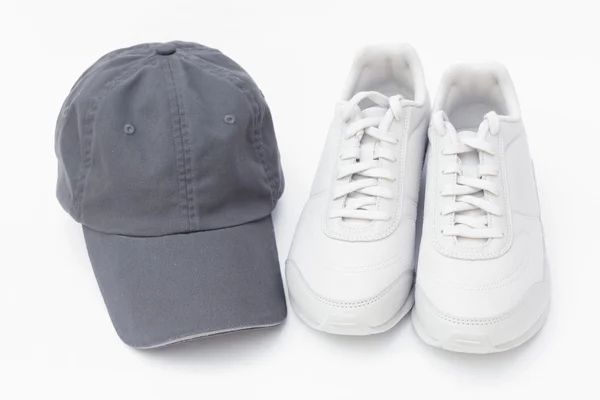 Running shoes and baseball cap — Stock Photo, Image